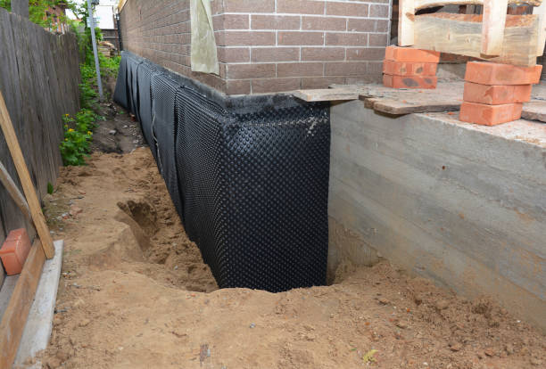 Happy homeowners after waterproofing job in Stamping Ground